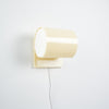 Beige wall-mounted lamp on a white background